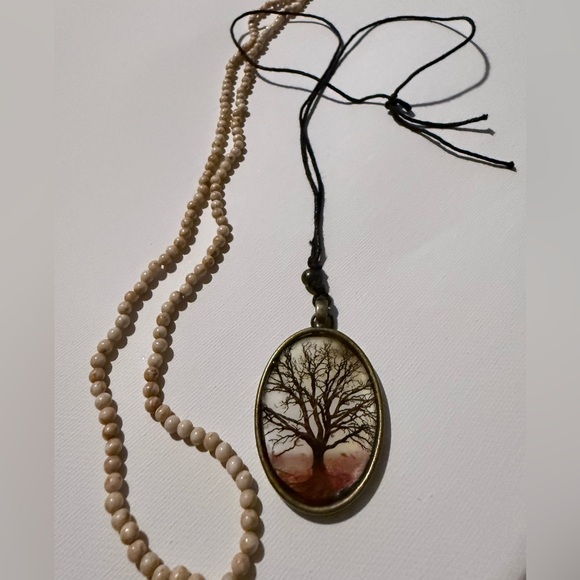 Jewelry - Vintage brass pendant with bare tree on cord